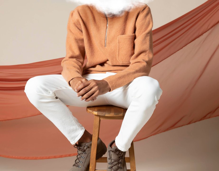 Person with cloud image covering their face, representing anxiety.